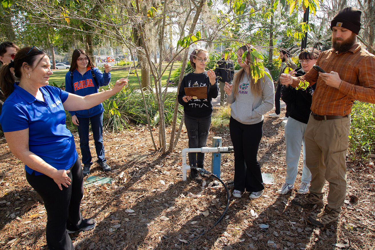 ‘Bee Garden Pollinator’ -- Dr. Sandra Wilson, a UF/IFAS professor of environmental horticulture, works with her students on the pollinator app.